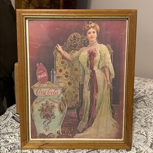 Coca-Cola Vintage Poster with Red and Gold Highlights